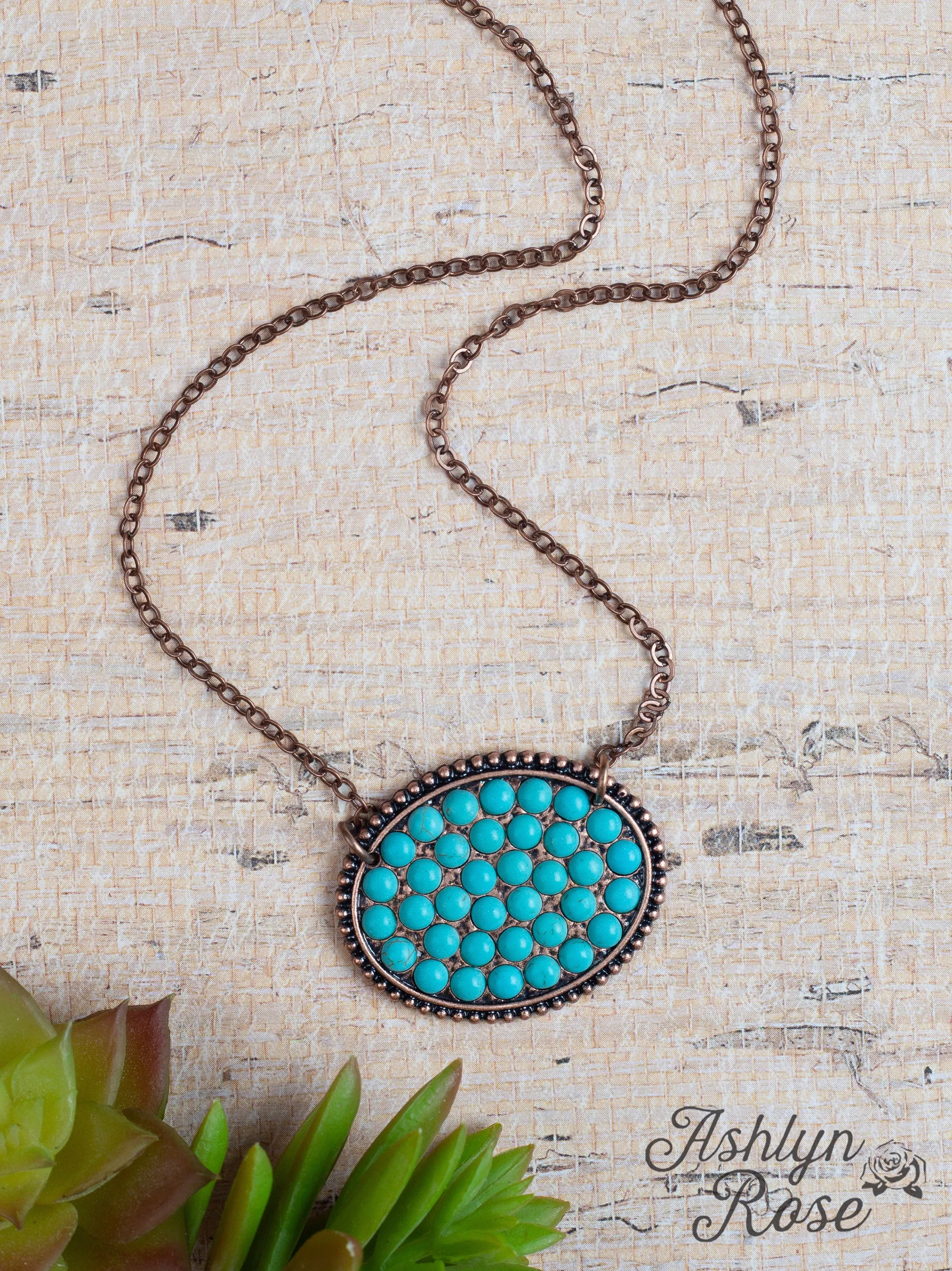 Bumpily Bamboozled Bronze Necklace With A Turquoise Pendant