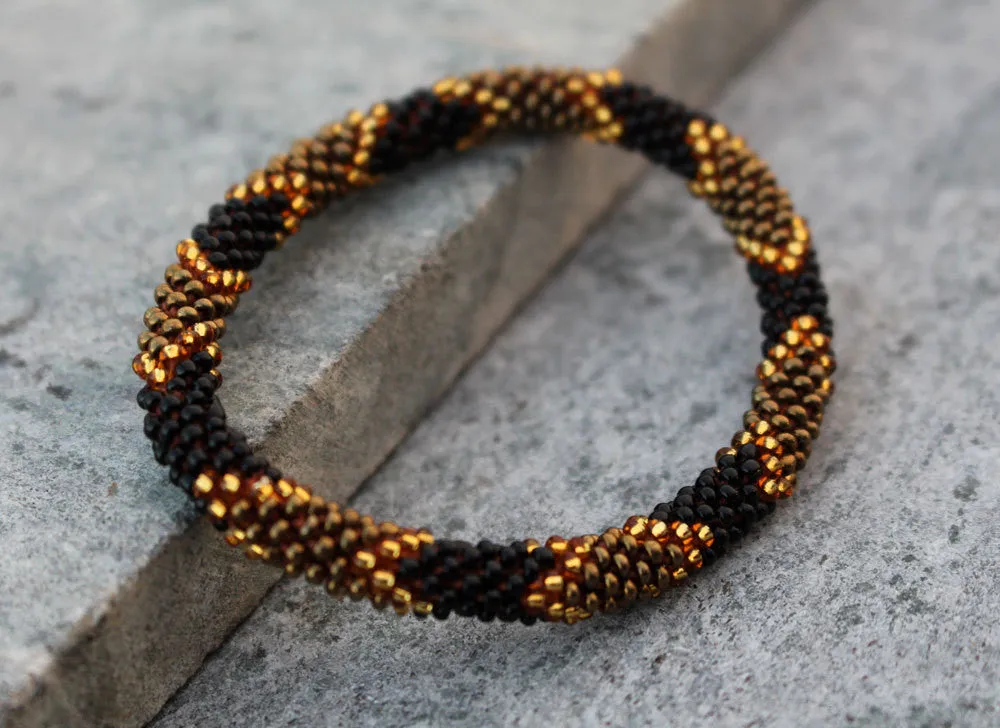 Golden Black Beads Roll Bracelet