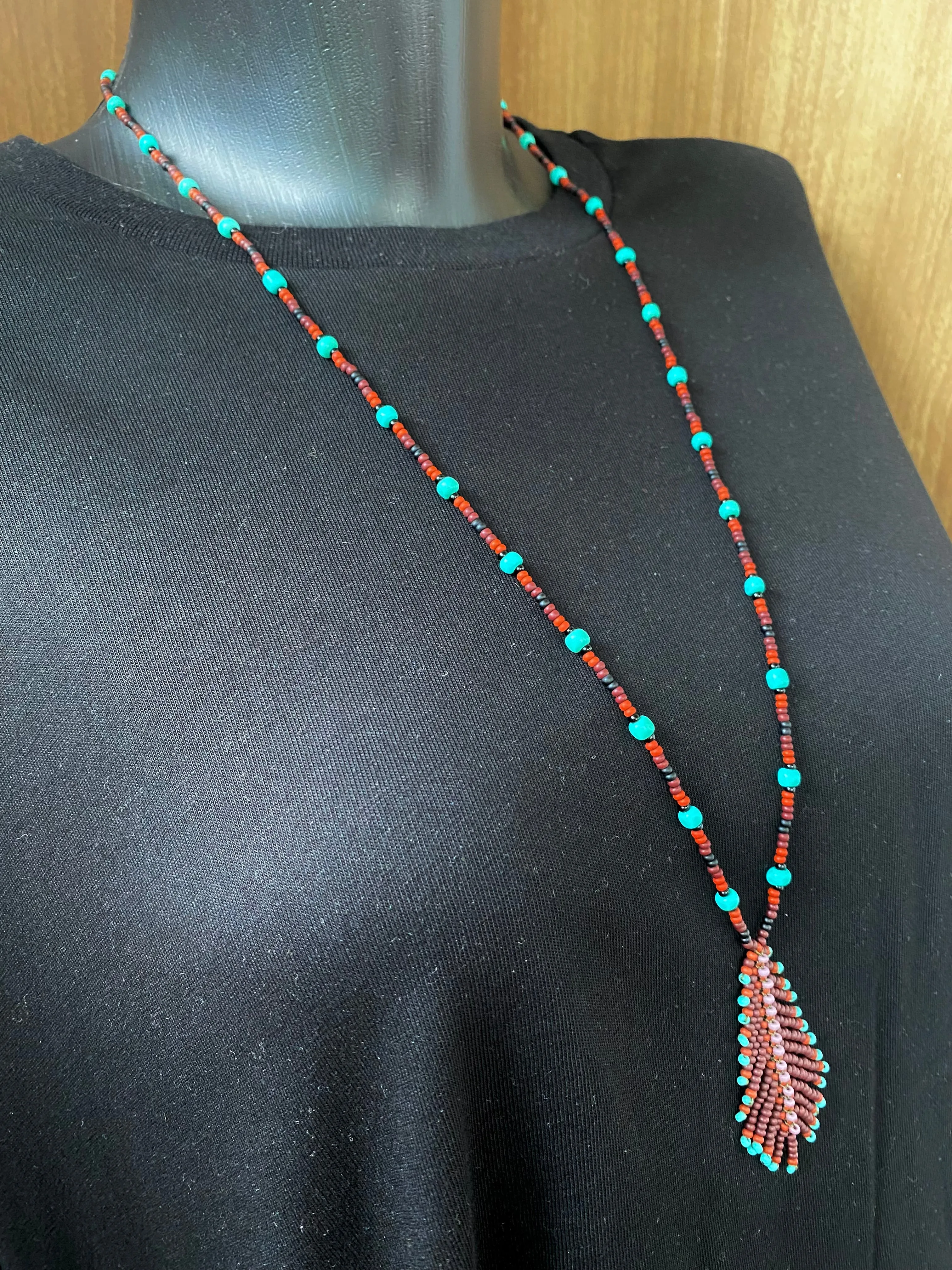 Handmade Seed Bead Feather Pendant Necklace for Women and Men in Boho Hippie style.